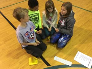Students participate in a Health Rocks activity at a local school.