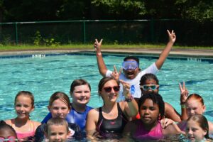 Youth swimming at summer camp