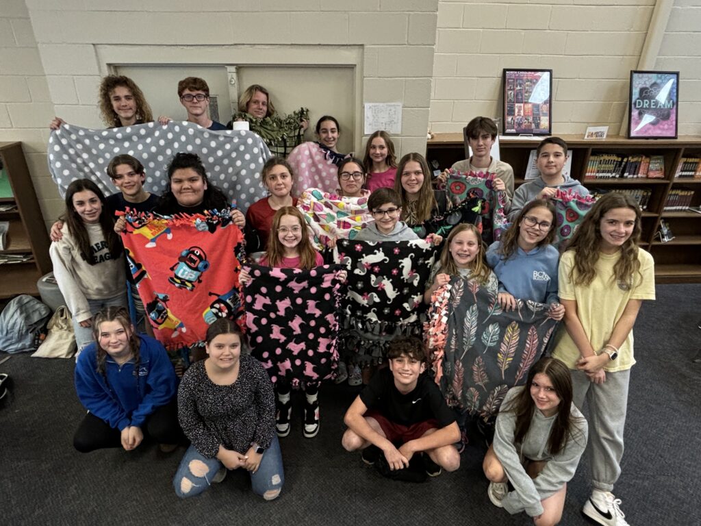 Broad Creek Middle School FBLA members with blankets they made to donate.